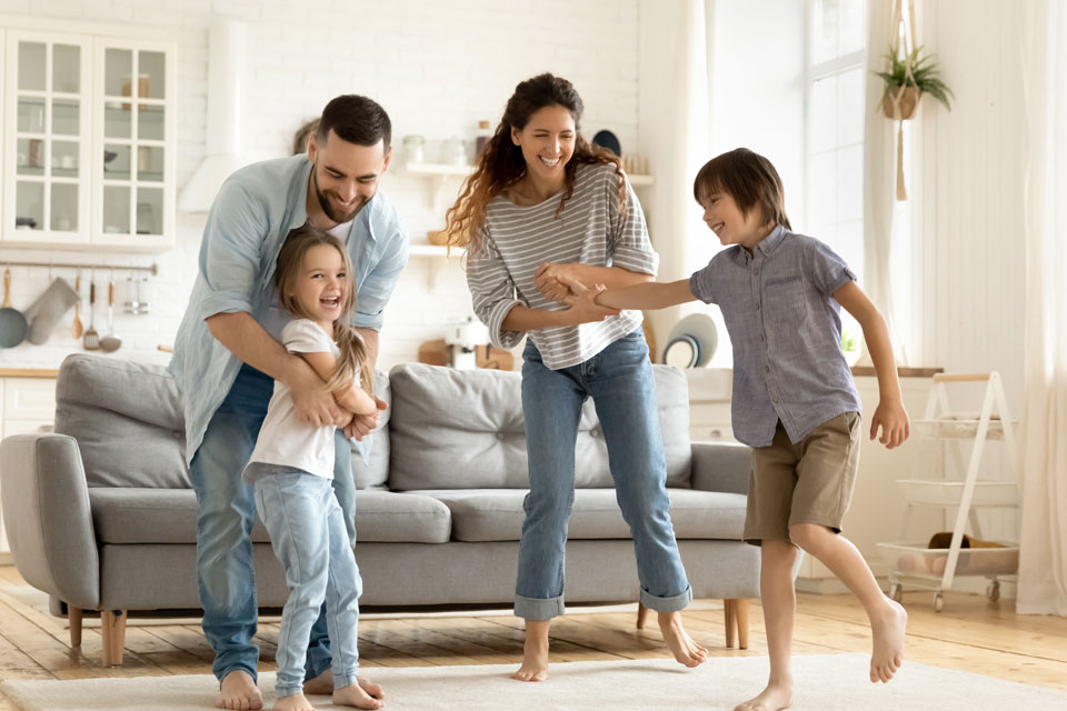WC-Hero-FamilyDancing-359539619-960×640-1 (1) Family dancing in their living room